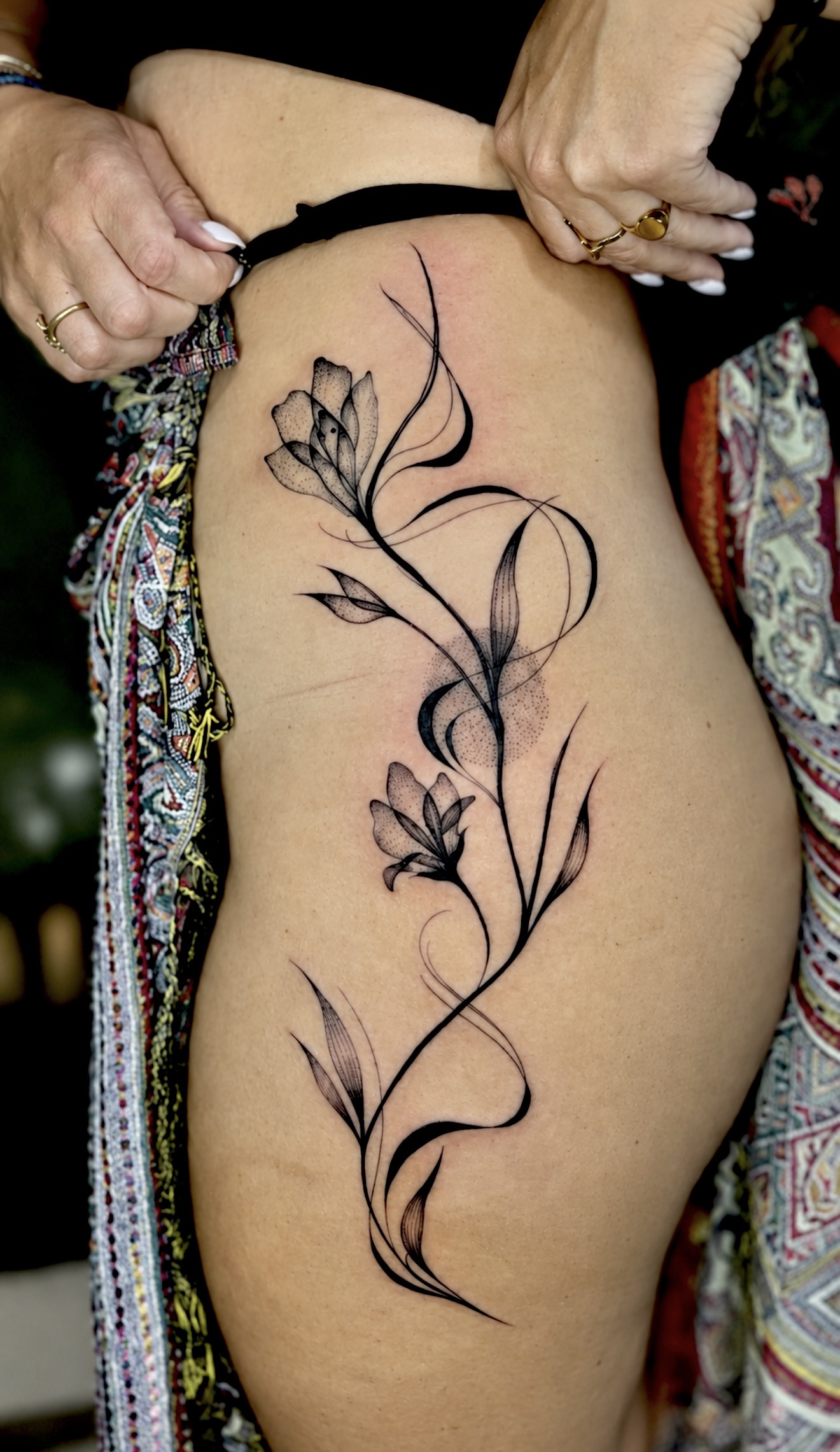 Fine line leafy vine tattoo